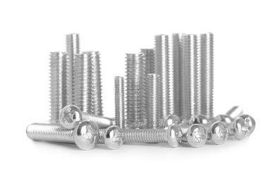 Photo of Many different metal bolts on white background