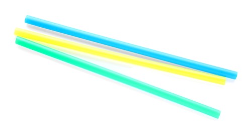 Photo of Color plastic cocktail tubes on white background