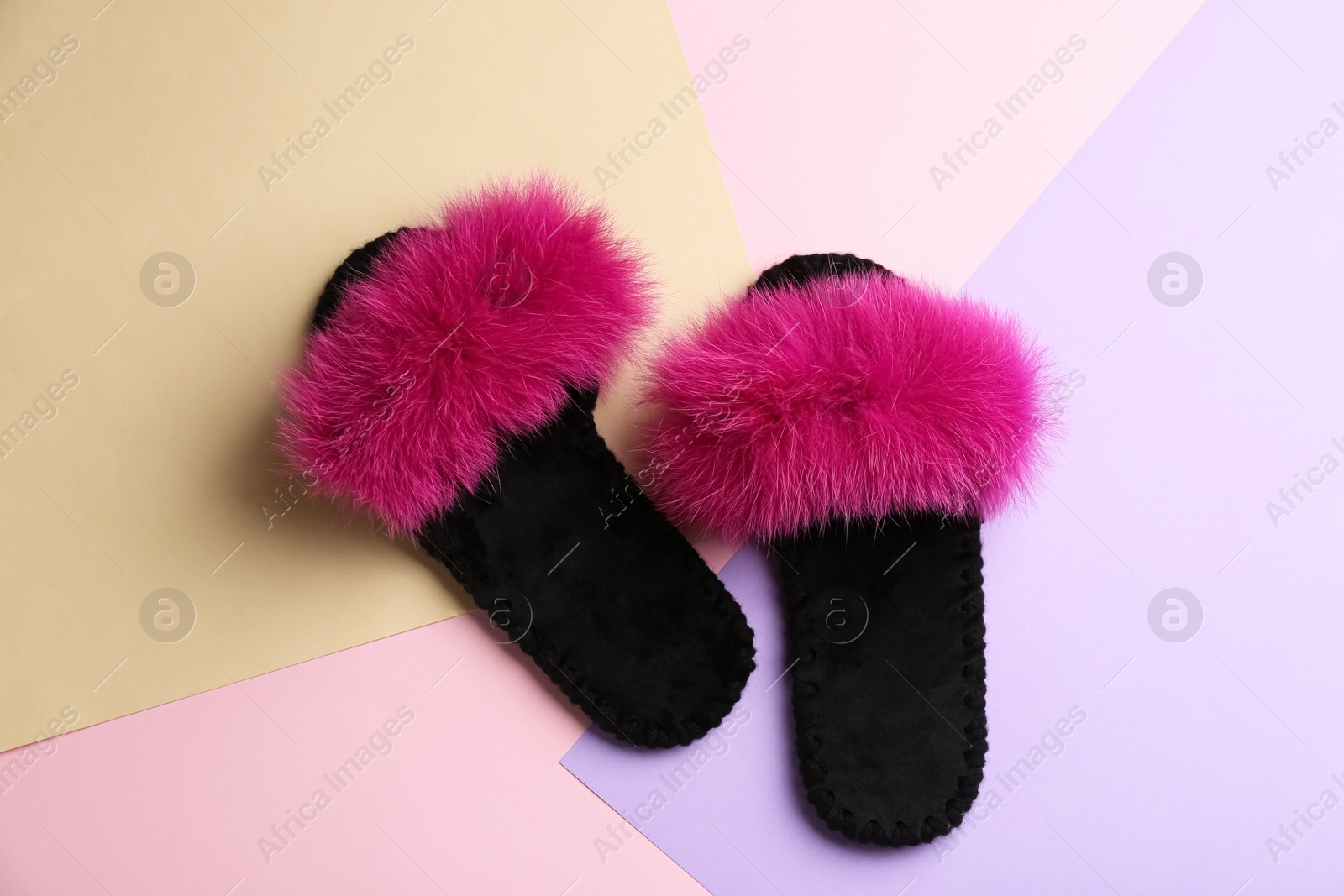 Photo of Pair of soft slippers on color background, flat lay