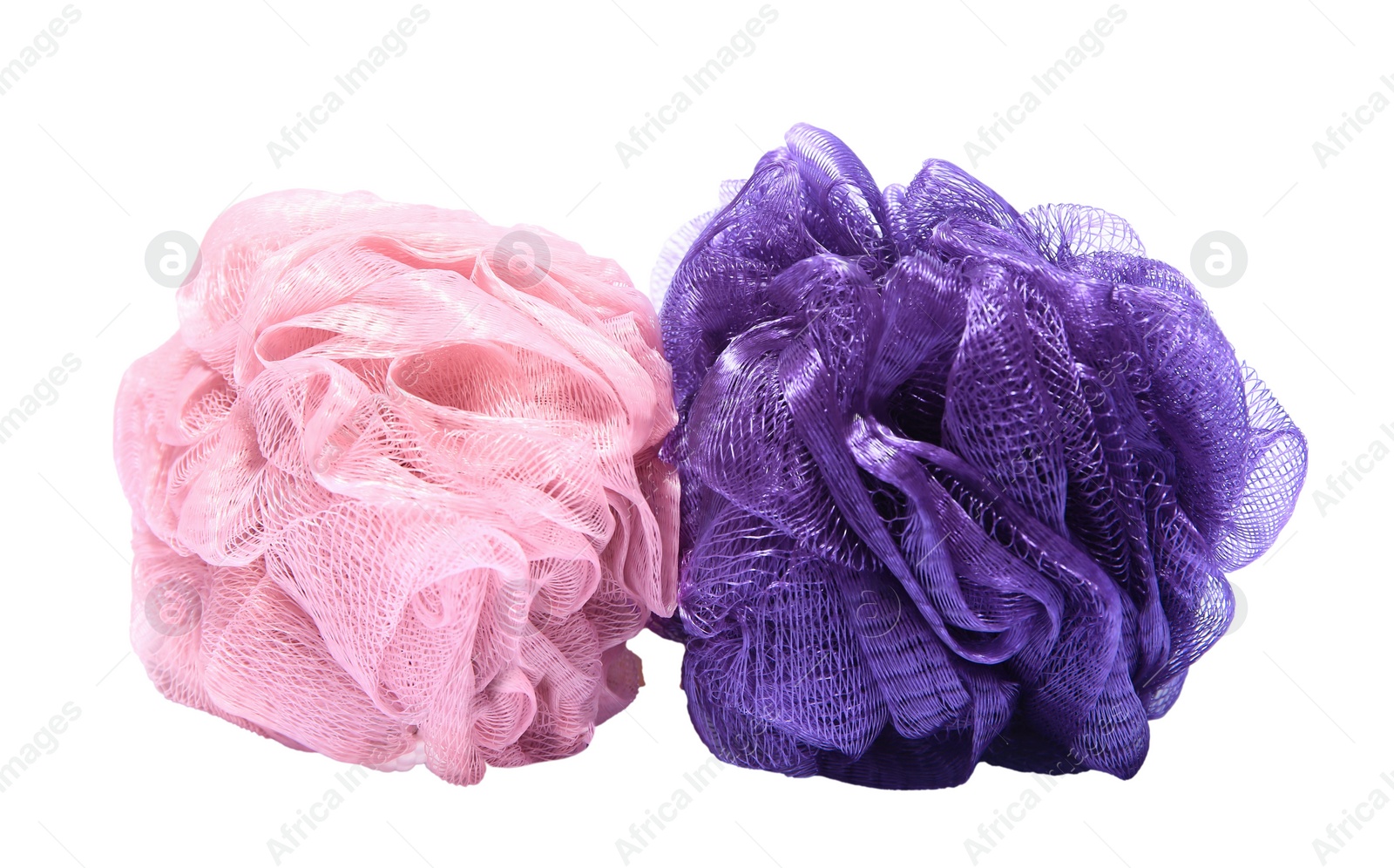 Photo of New shower puffs on white background. Personal hygiene