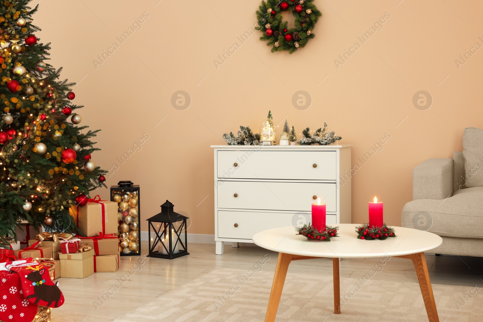 Photo of Christmas interior. Beautiful tree decorated with baubles in room with cozy furniture