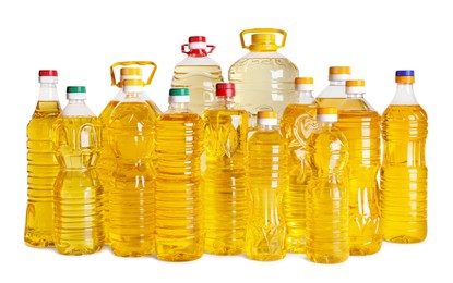 Photo of Bottles of cooking oil on white background