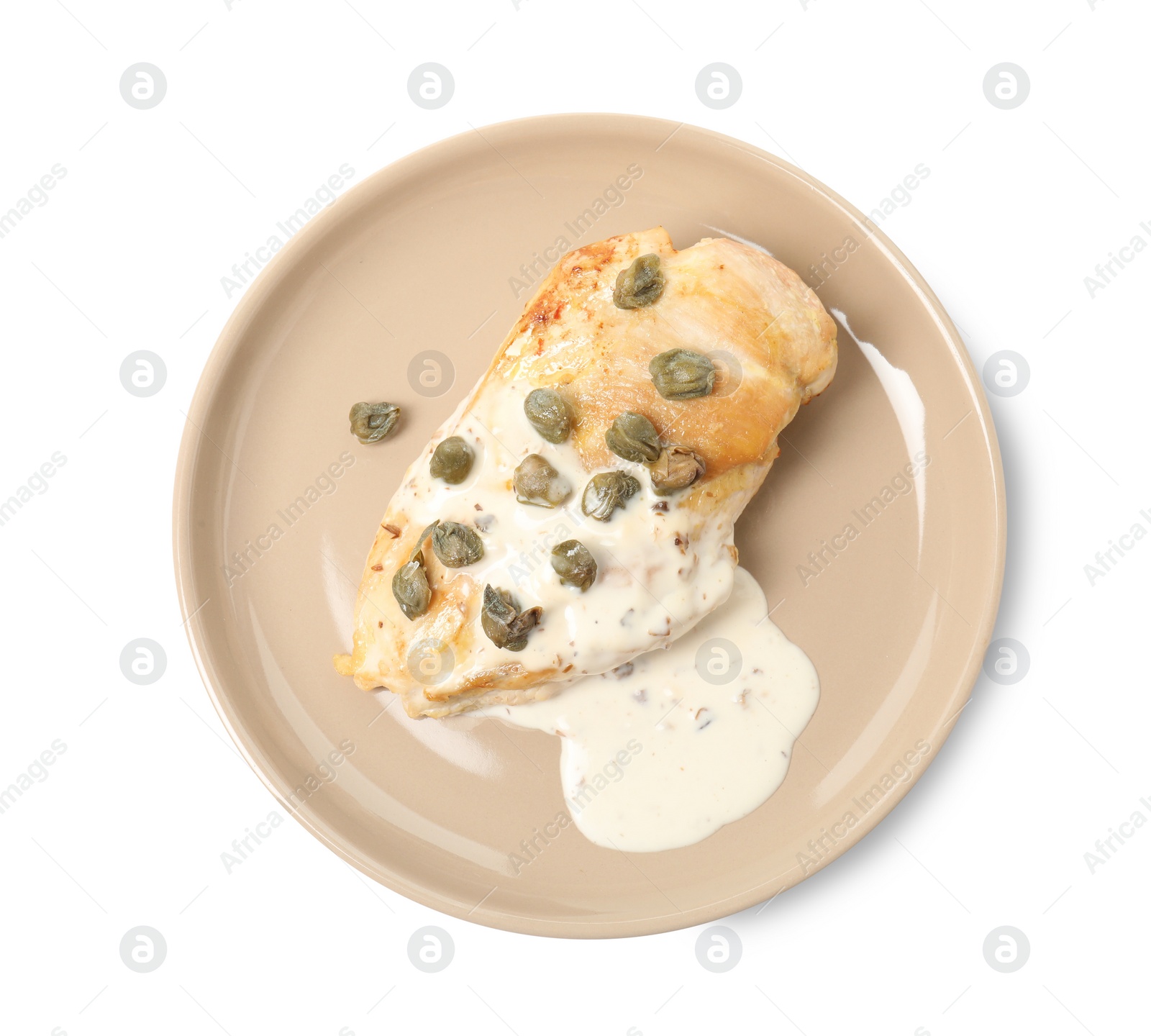 Photo of Delicious chicken fillet with capers and sauce isolated on white, top view