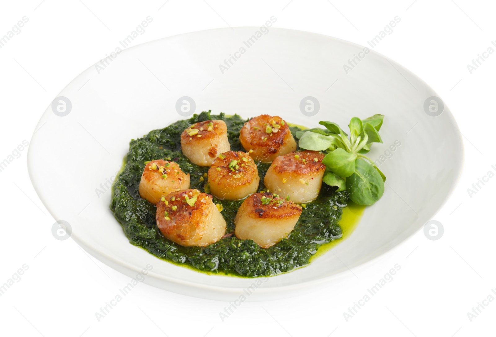 Photo of Delicious fried scallops with tasty sauce and corn salad in bowl isolated on white