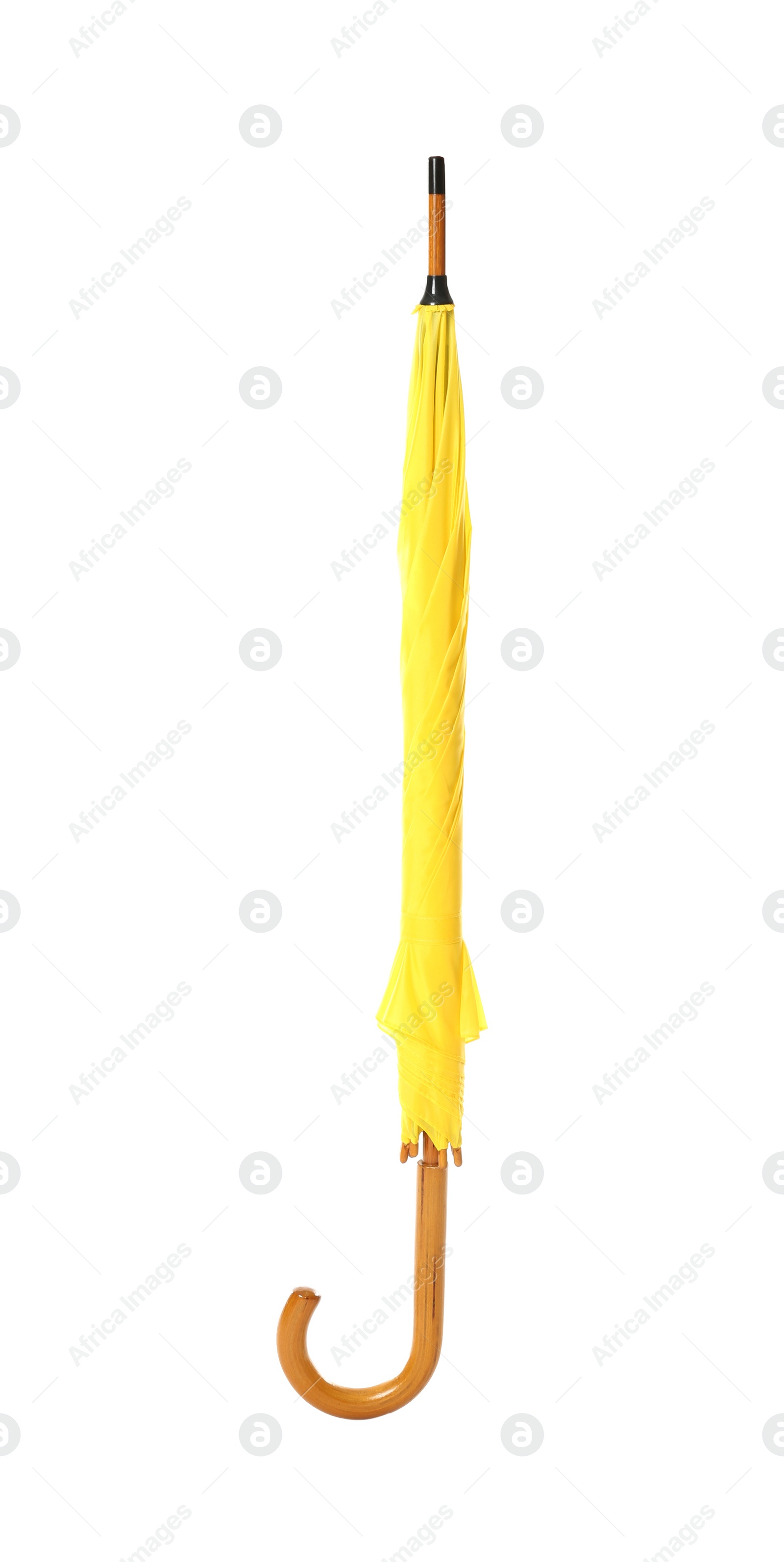 Photo of Modern closed yellow umbrella isolated on white