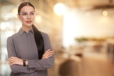 Lawyer, consultant, business owner. Confident woman with eyeglasses indoors, space for text