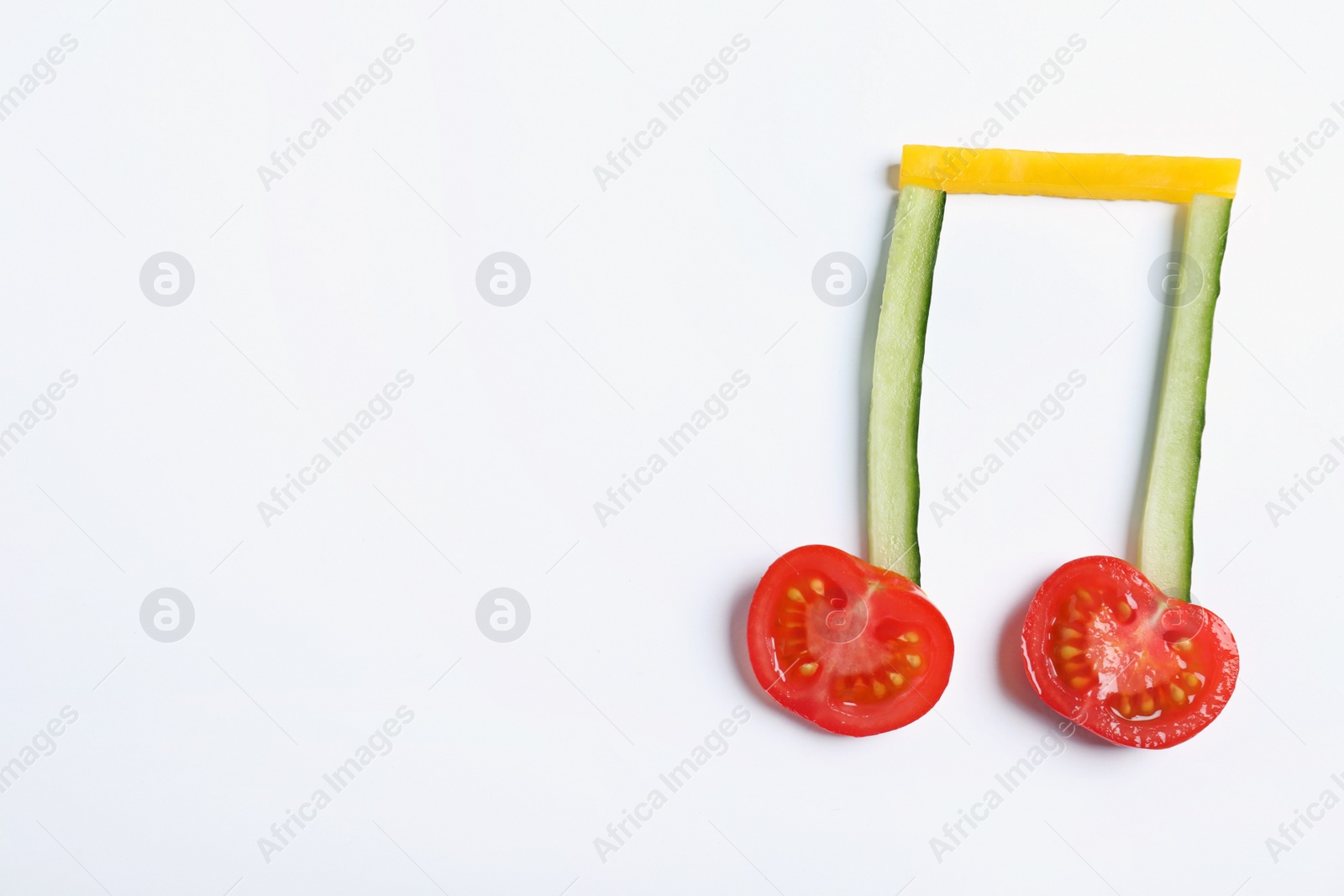 Photo of Musical note made of vegetables on white background, top view