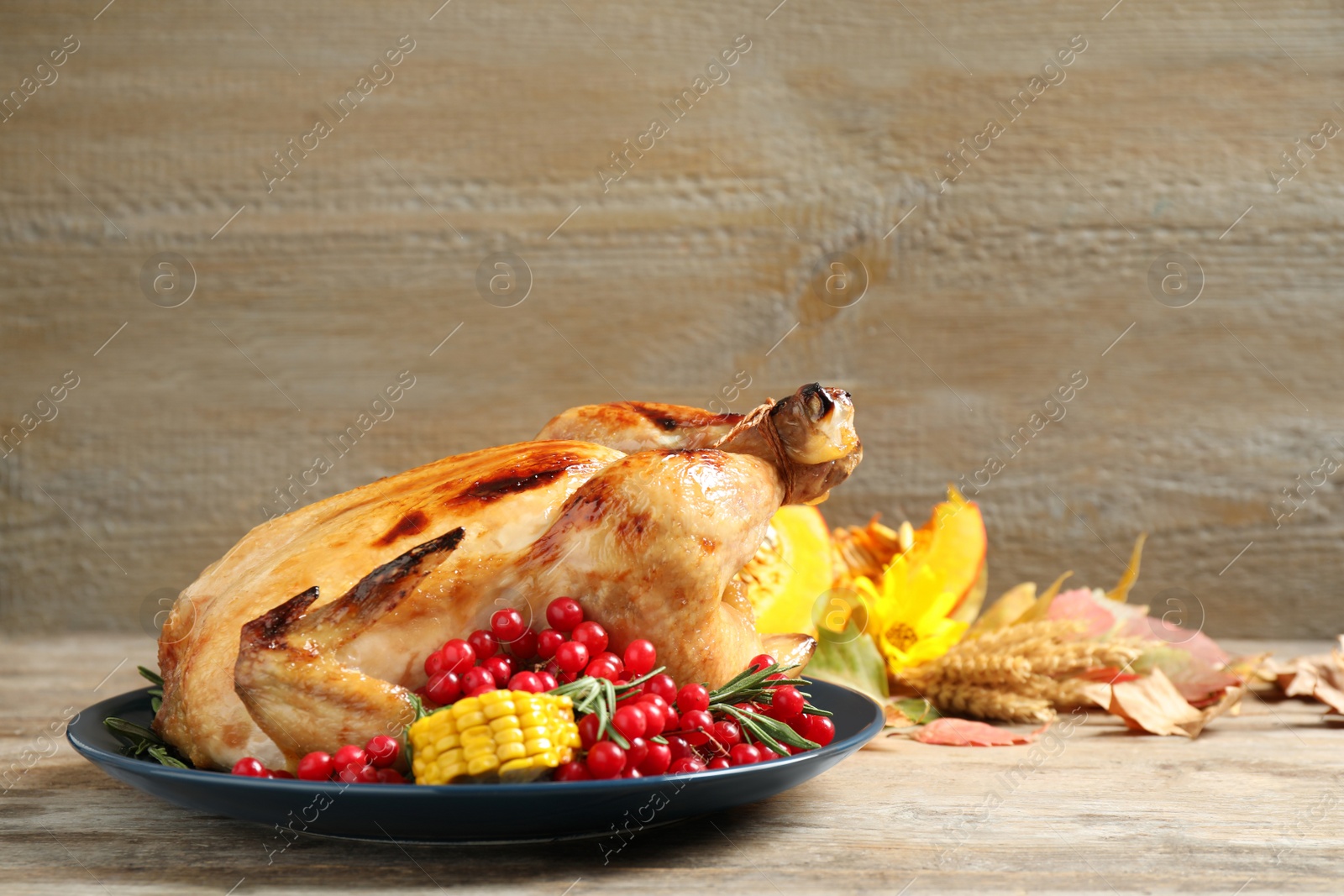 Photo of Plate with delicious turkey on wooden background, space for text. Happy Thanksgiving day