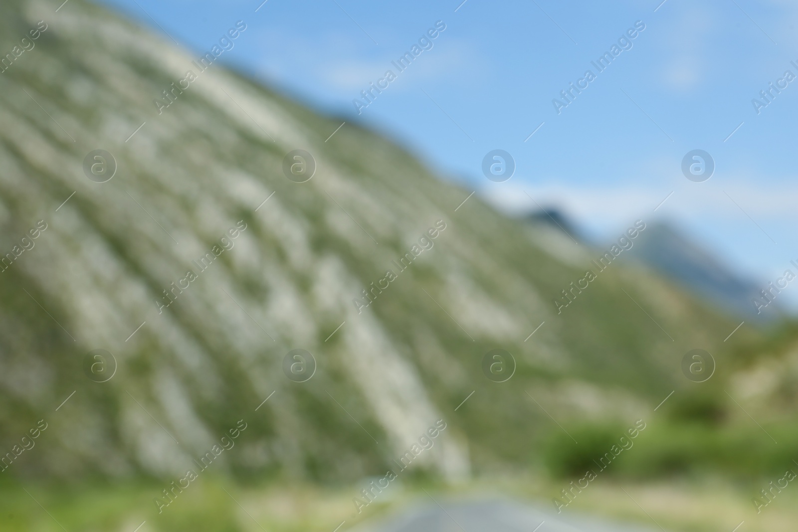 Photo of Blurred view of high mountains under sky outdoors