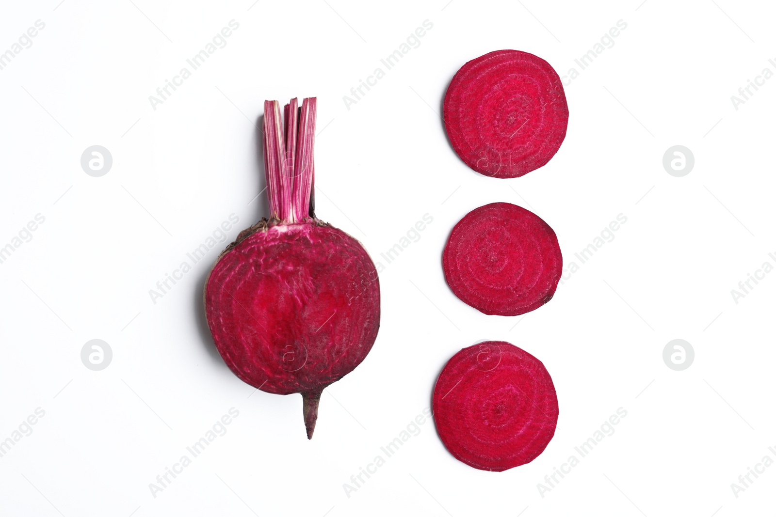 Photo of Composition with cut raw beets on white background, top view