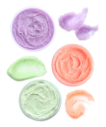 Image of Set with different samples and containers of natural scrubs on white background, top view  
