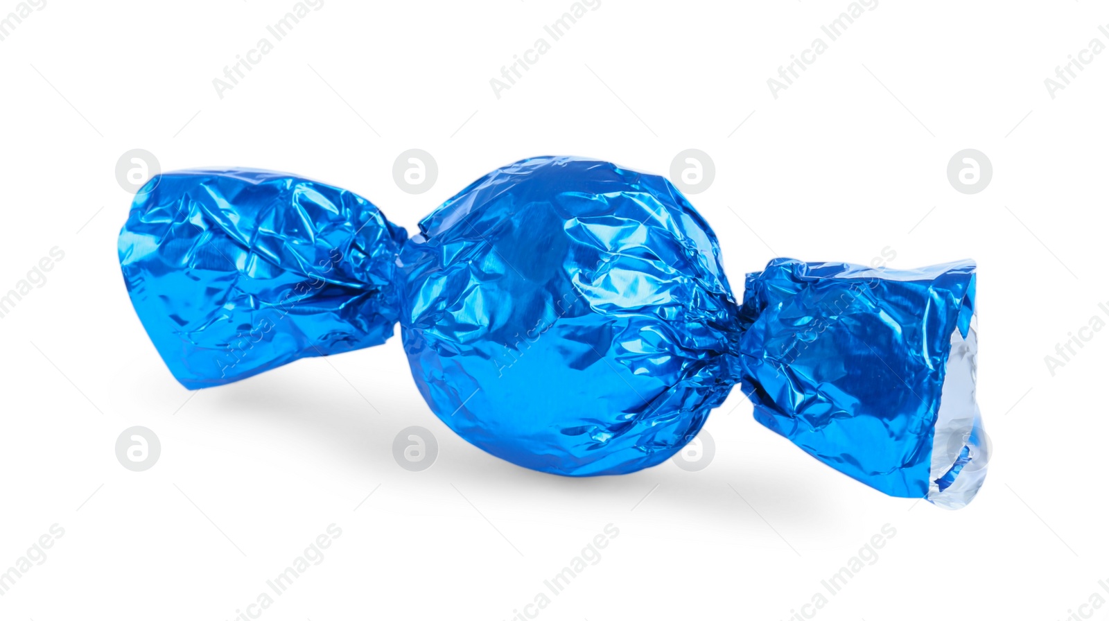 Photo of Tasty candy in blue wrapper isolated on white