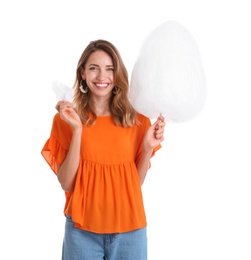 Photo of Happy young woman with cotton candy on white background