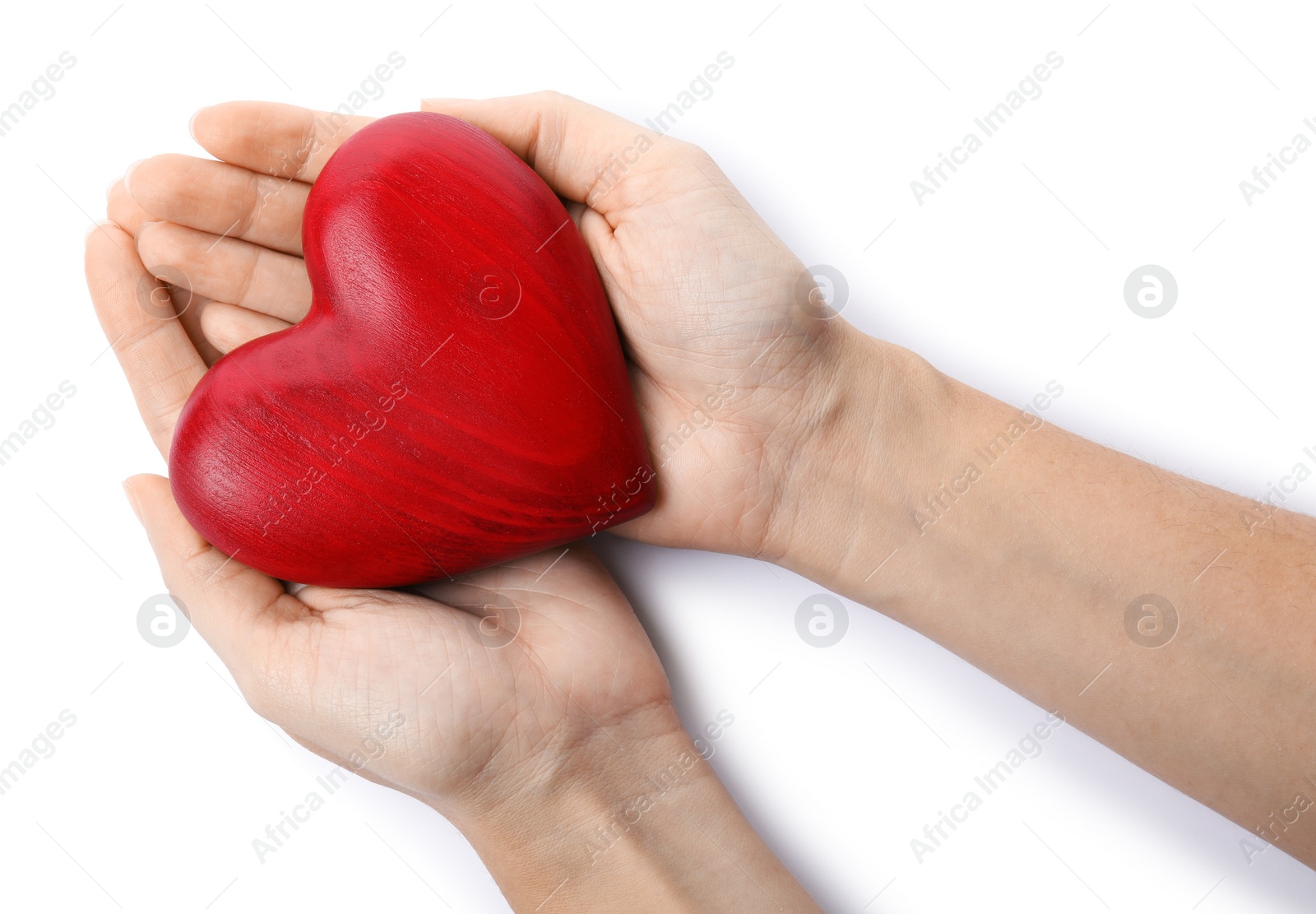 Photo of Woman holding red heart on white background, top view. Cardiology concept