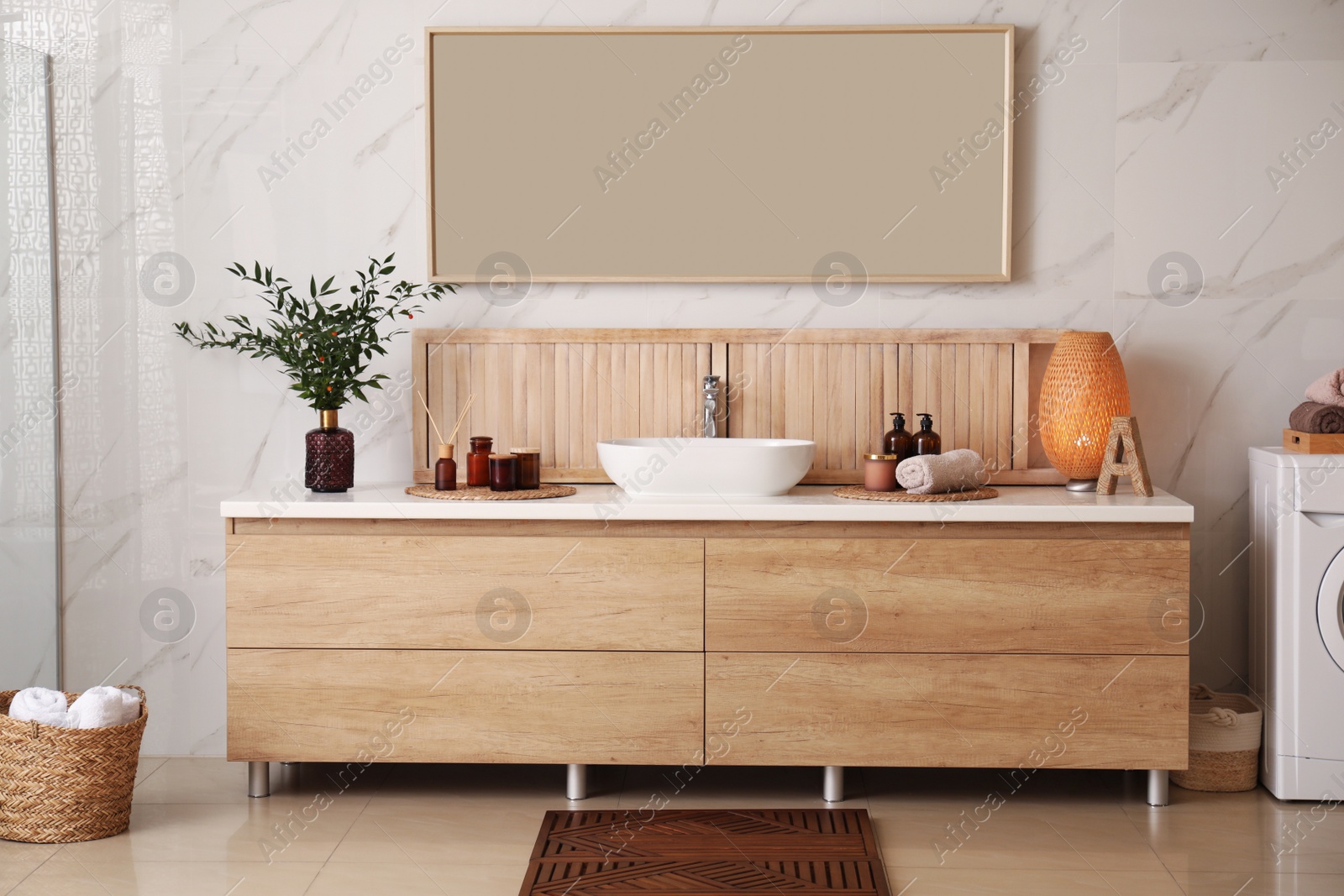 Photo of Modern bathroom interior with stylish mirror and vessel sink