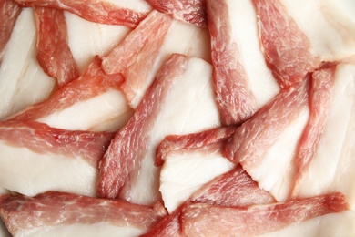 Slices of tasty bacon as background, closeup