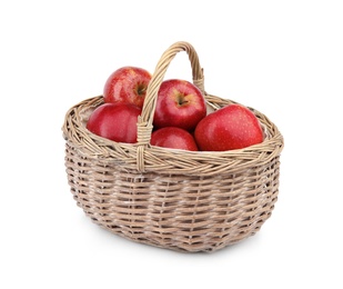 Photo of Wicker basket of ripe juicy red apples on white background