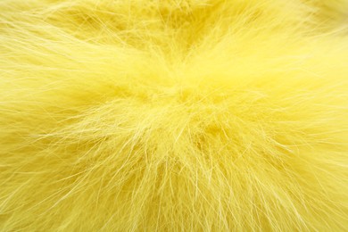 Photo of Texture of yellow faux fur as background, closeup