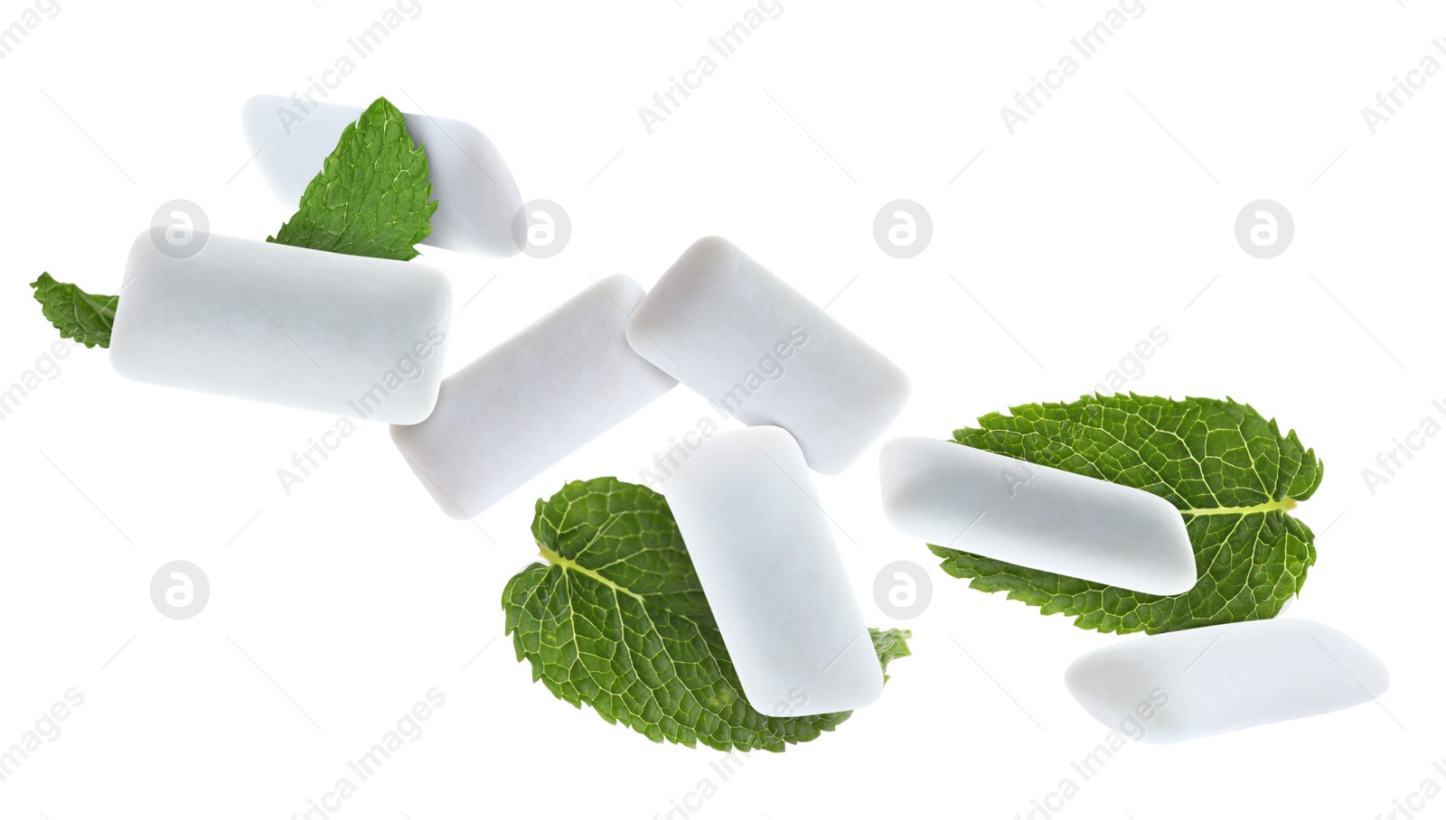 Image of Fresh mint leaves and chewing gum pads falling on white background