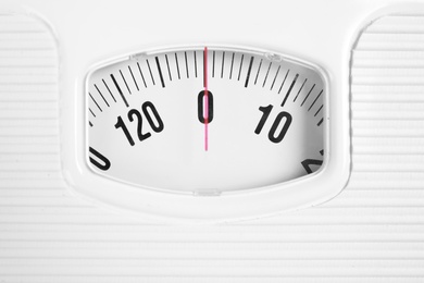 Photo of Modern scales, closeup view. Diet and weight loss