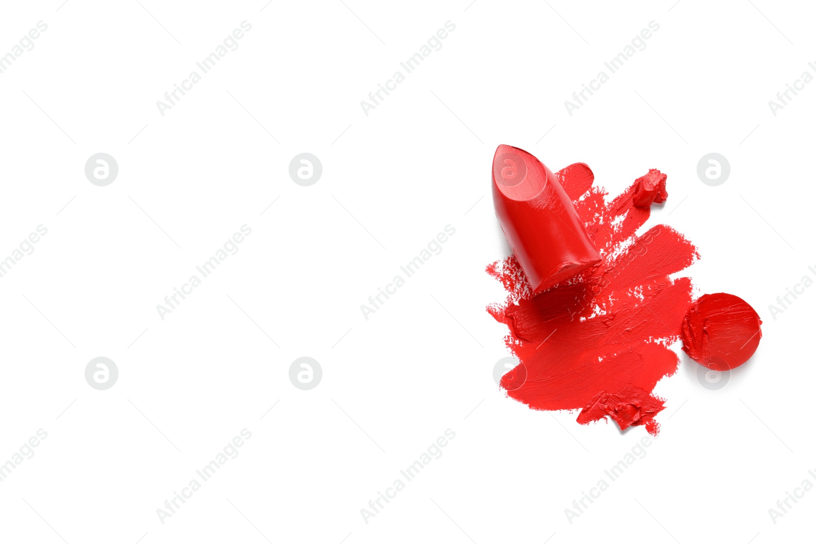 Photo of Stroke and lipstick on white background, top view