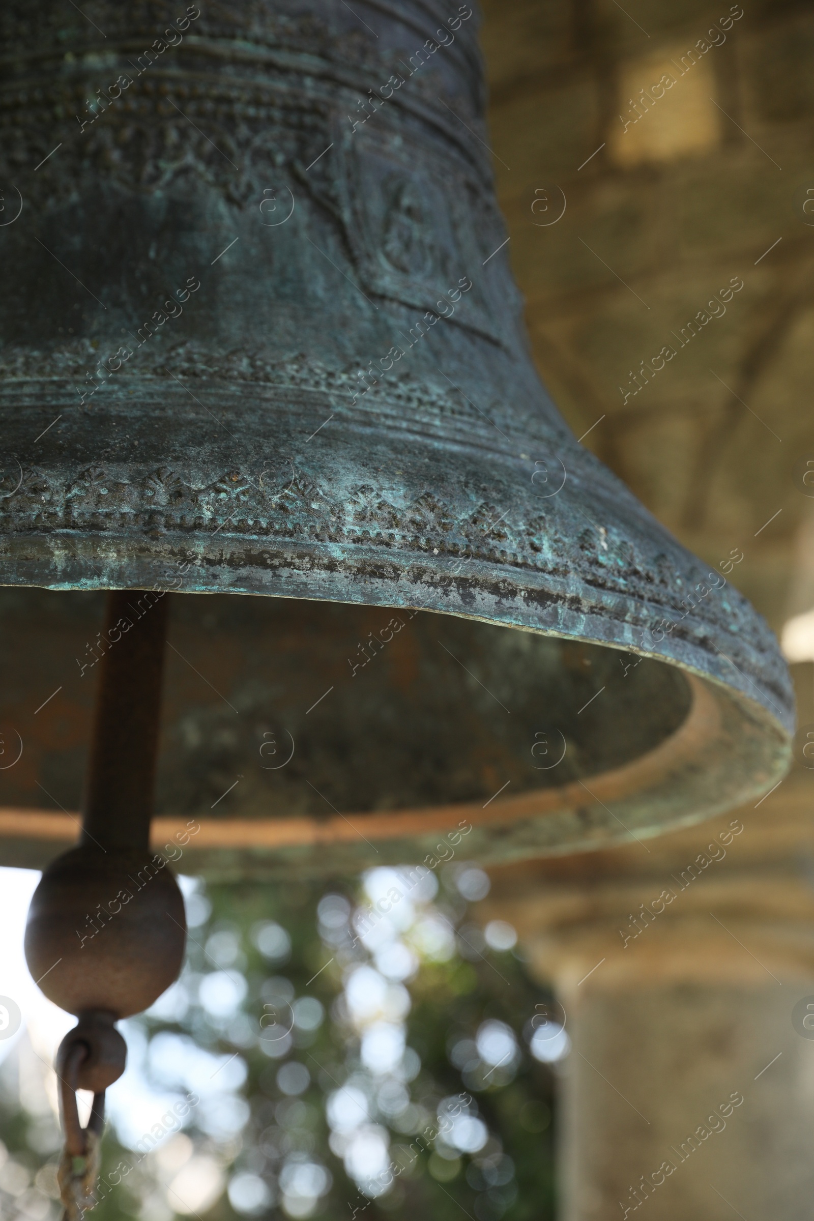 Photo of Closeup view of large old bell in tower