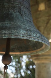 Photo of Closeup view of large old bell in tower