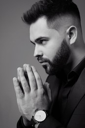 Photo of Handsome bearded man on grey background. Black and white effect