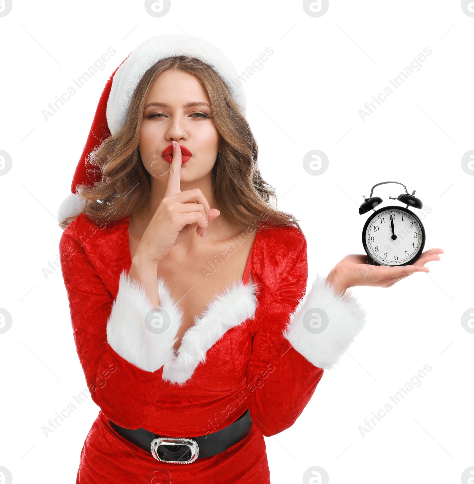 Photo of Beautiful Santa girl with alarm clock on white background. Christmas celebration