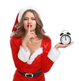 Beautiful Santa girl with alarm clock on white background. Christmas celebration