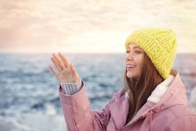 Photo of Portrait of beautiful young woman near sea