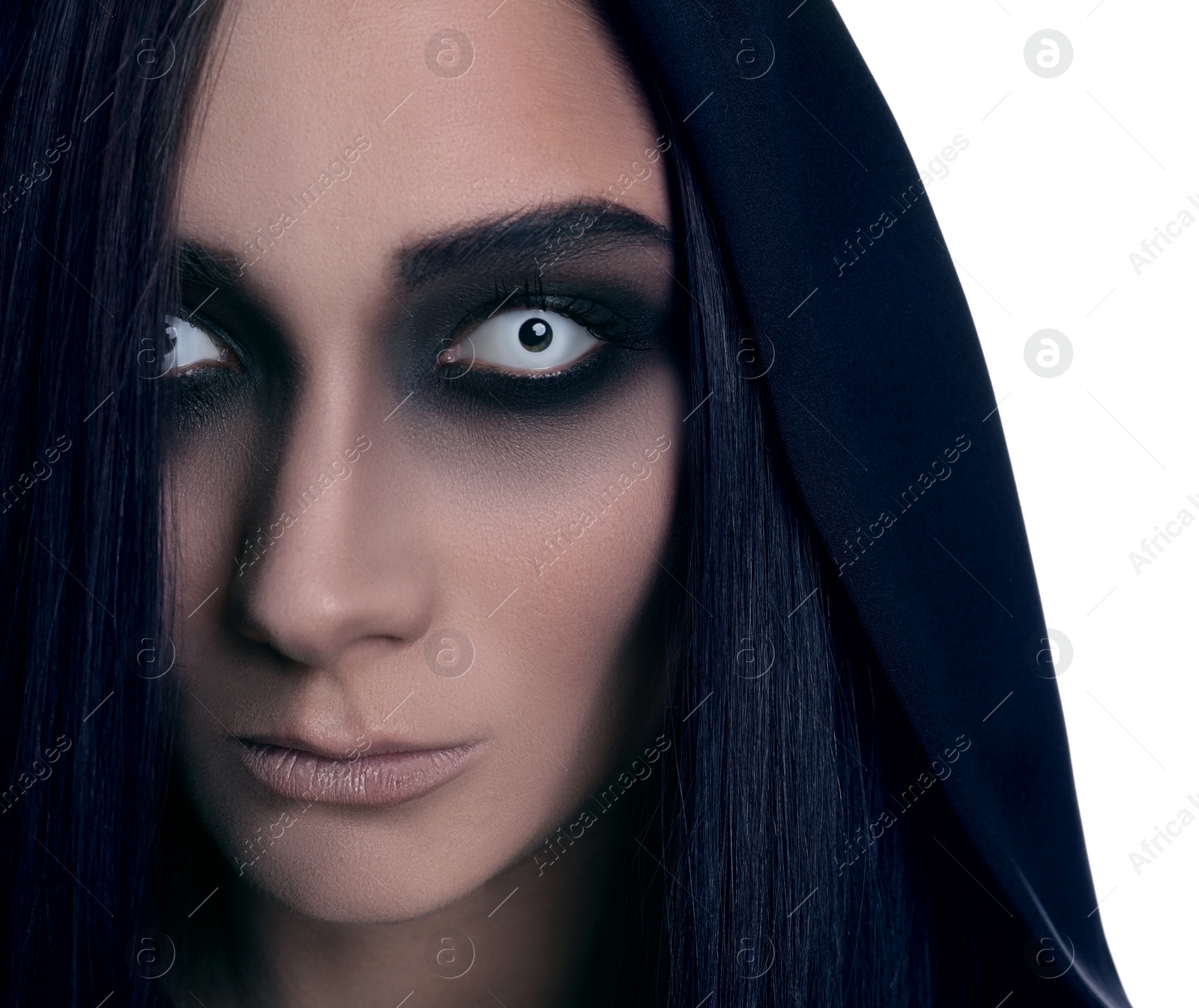 Photo of Mysterious witch with spooky eyes on white background, closeup