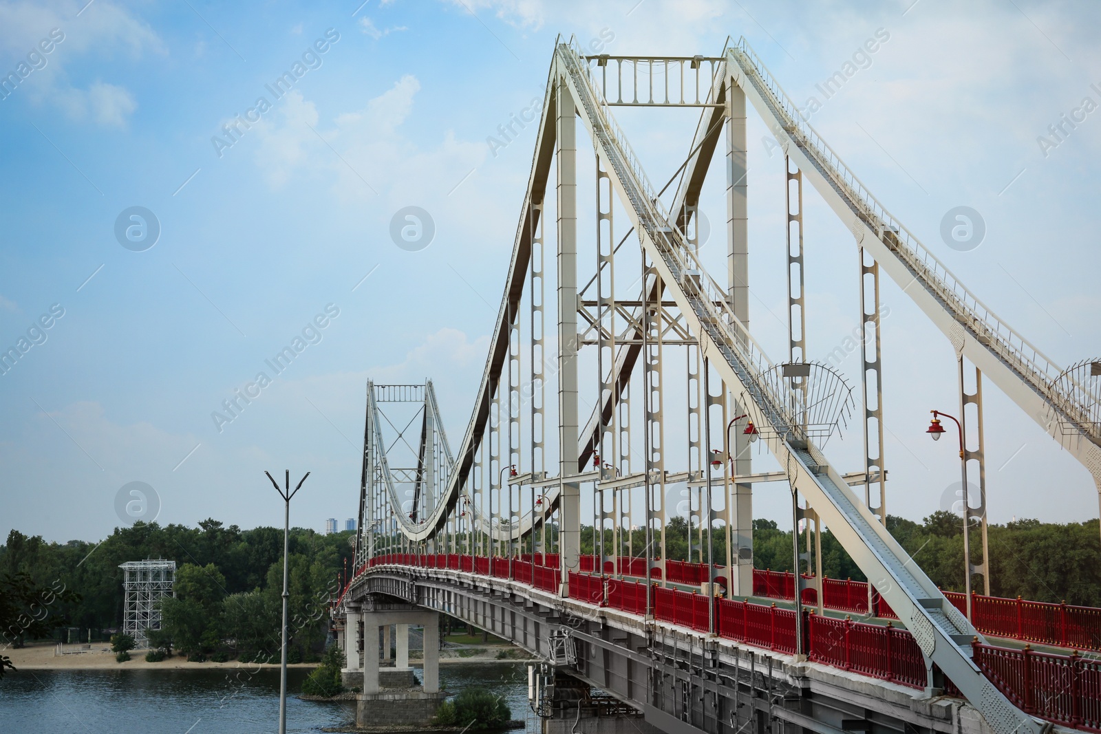 Photo of KYIV, UKRAINE - AUGUST 11, 2022: Beautiful view of modern pedestrian Park bridge over Dnipro river