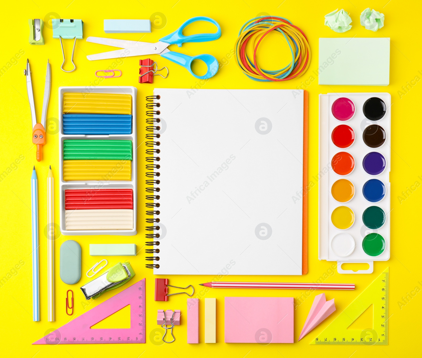 Photo of Flat lay composition with different school stationery on yellow background, space for text. Back to school