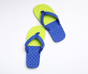 Pair of flip flops on white background, top view. Beach accessories