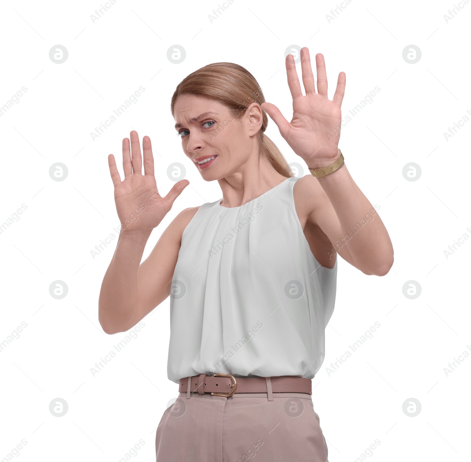 Photo of Beautiful businesswoman avoiding something on white background