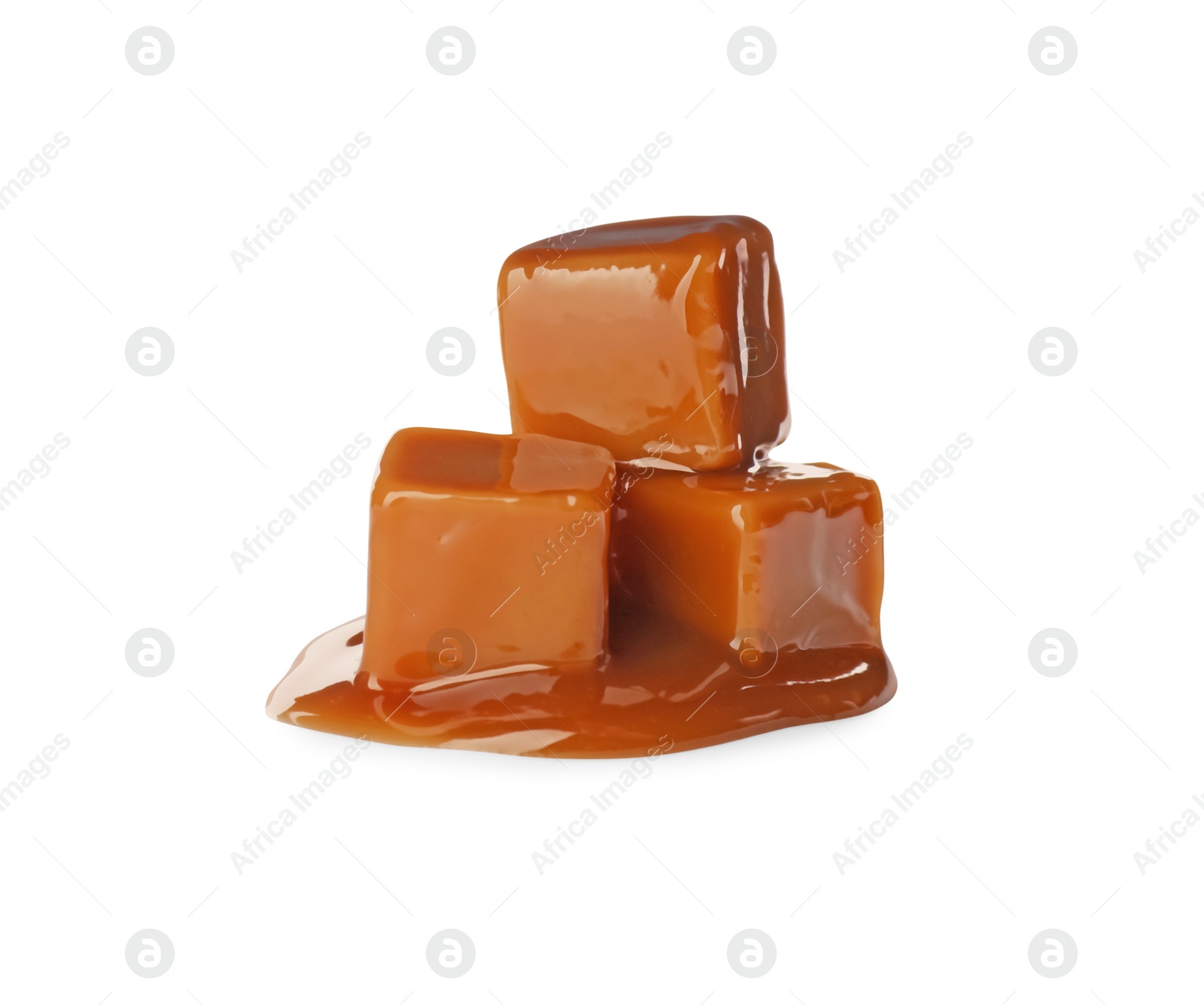 Photo of Caramel candies with topping on white background