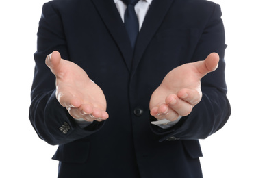 Photo of Businessman holding something against white background, focus on hands