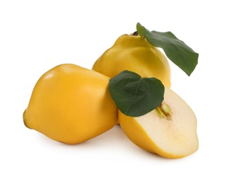 Photo of Whole and cut delicious quinces on white background