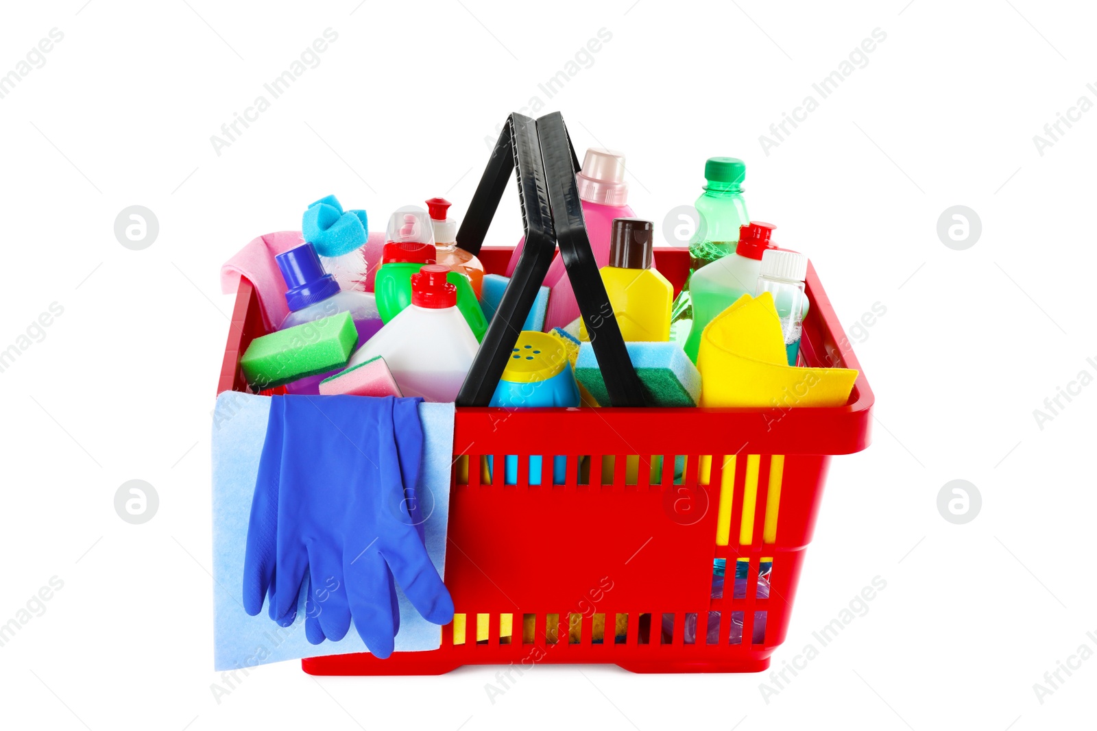 Photo of Shopping basket with different detergents, rag and gloves on white background