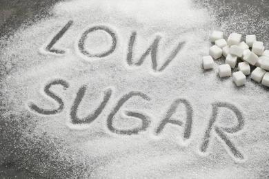 Composition with phrase LOW SUGAR on grey table