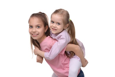 Photo of Portrait of cute little sisters on white background