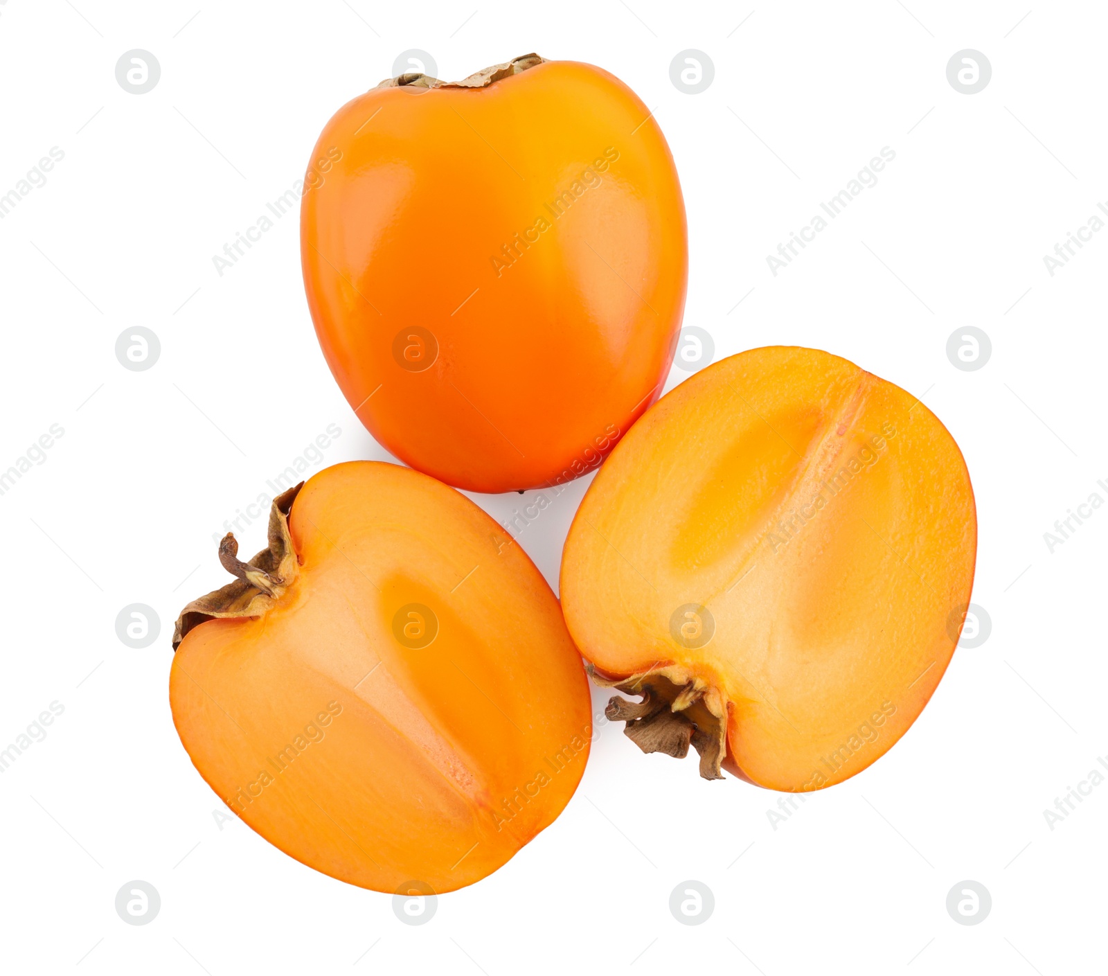 Photo of Whole and cut persimmon fruits isolated on white, top view