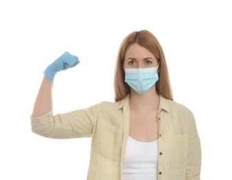 Photo of Woman with protective mask and gloves showing muscles on white background. Strong immunity concept