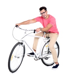 Photo of Handsome young hipster man with bicycle on white background