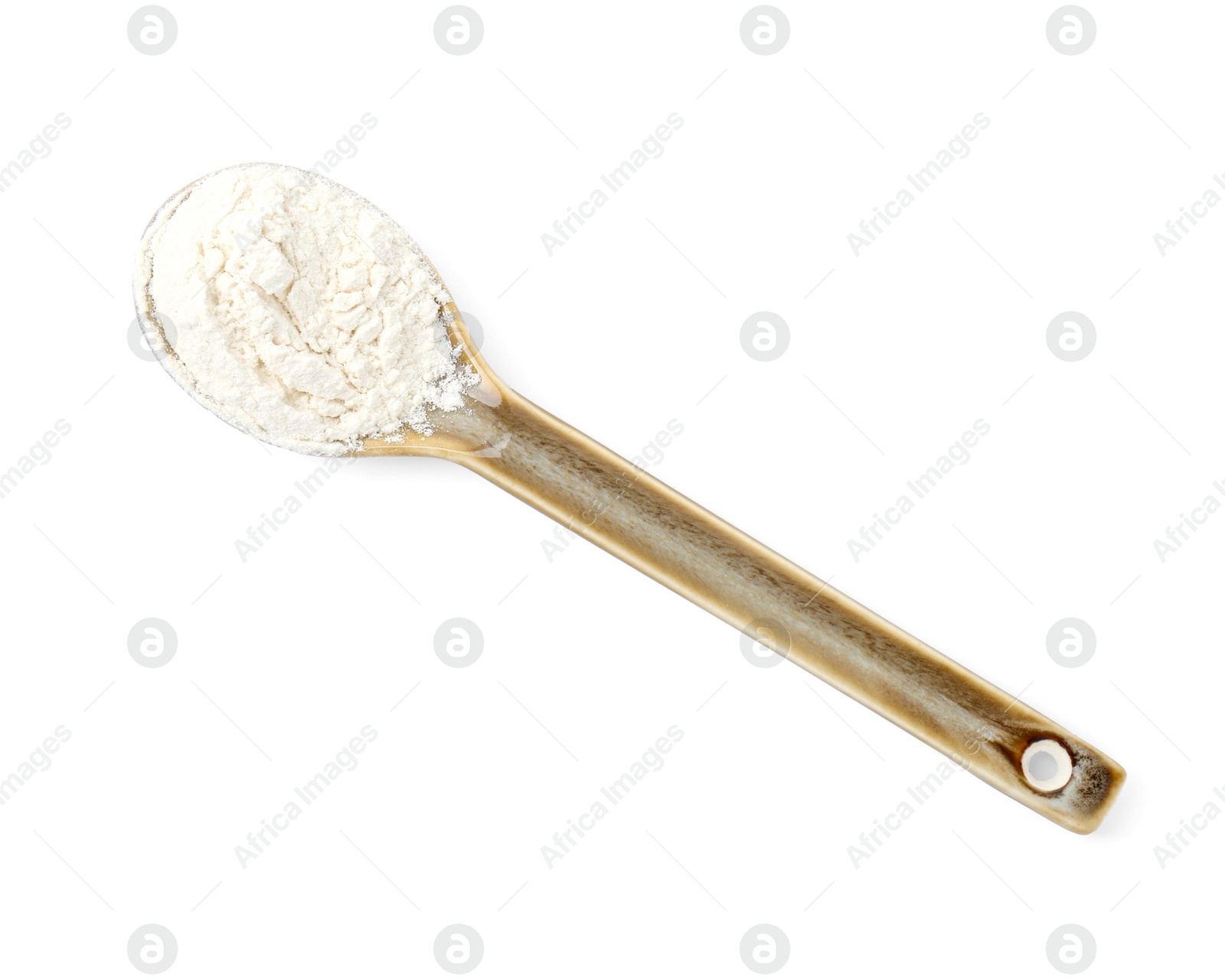 Photo of Baking powder in spoon isolated on white, top view