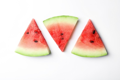 Slices of ripe watermelon on white background, top view