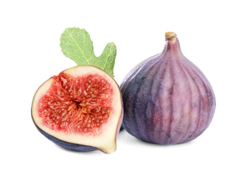 Whole and cut purple figs on white background