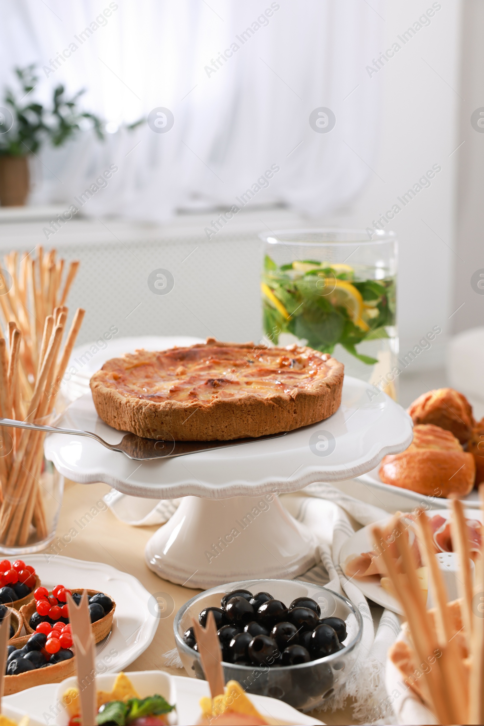 Photo of Dishes with different food on table in room. Luxury brunch