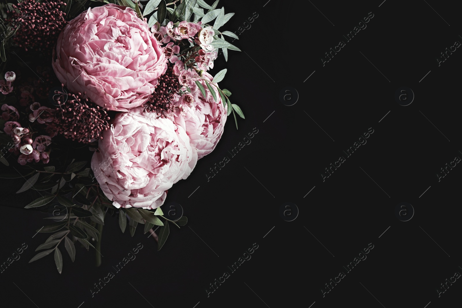 Photo of Bouquet of beautiful flowers on black background, space for text. Floral card design with dark vintage effect